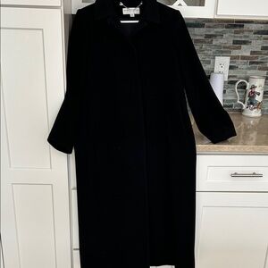 Black cashmere/wool coat, lined with flap to cover buttons.